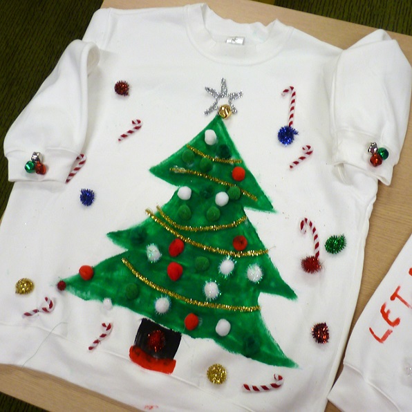 Hand painted Christmas jumper featuring a christmas tree with baubles